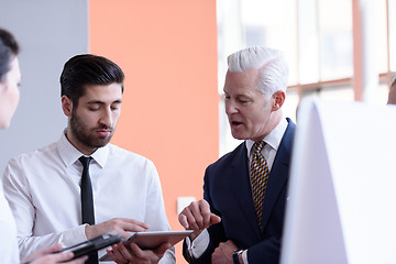 Image showing young startup businessman making presentation to senior investio