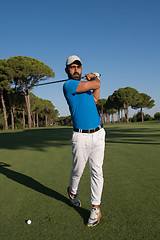 Image showing golf player hitting shot