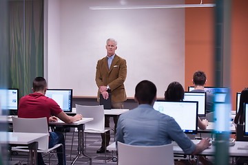 Image showing teacher and students in computer lab classroom