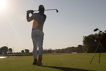 Image showing golf player hitting shot