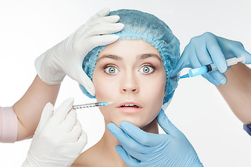 Image showing Attractive woman at plastic surgery with syringe in her face