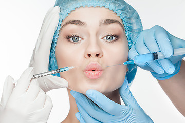 Image showing Attractive woman at plastic surgery with syringe in her face