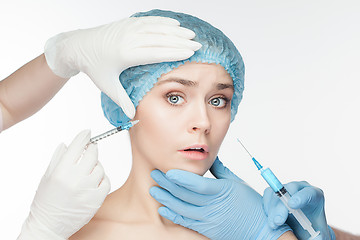 Image showing Attractive woman at plastic surgery with syringe in her face