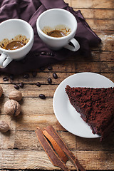 Image showing Chocolate cake, coffee and cinnamon sticks