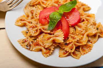 Image showing Italian pasta farfalle butterfly bow-tie and tomato sauce