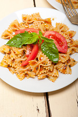 Image showing Italian pasta farfalle butterfly bow-tie and tomato sauce