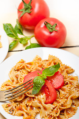 Image showing Italian pasta farfalle butterfly bow-tie and tomato sauce