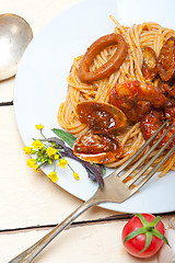 Image showing Italian seafood spaghetti pasta on red tomato sauce 