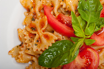 Image showing Italian pasta farfalle butterfly bow-tie and tomato sauce