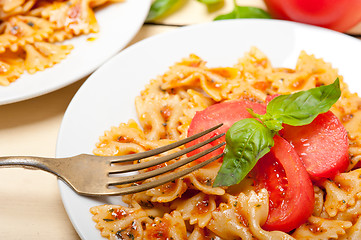 Image showing Italian pasta farfalle butterfly bow-tie and tomato sauce