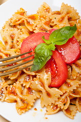 Image showing Italian pasta farfalle butterfly bow-tie and tomato sauce