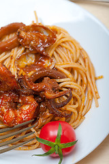 Image showing Italian seafood spaghetti pasta on red tomato sauce 