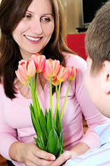 Image showing Mother with bouquet of flowers