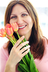 Image showing Mature woman with flowers