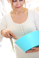 Image showing Mature woman cooking at home