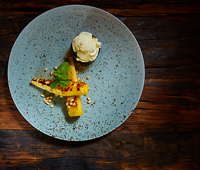 Image showing Grilled pineapple with vanilla ice cream