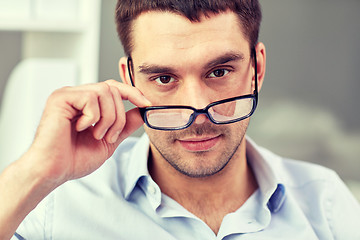 Image showing portrait of businessman in eyeglasses at office