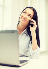 Image showing smiling businesswoman or student with smartphone