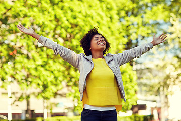 Image showing happy african american young woman in summer park