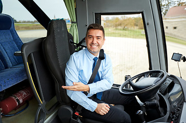 Image showing happy driver inviting on board of intercity bus