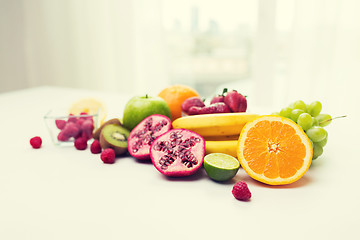 Image showing close up of fresh fruits and berries on table