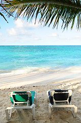 Image showing Beach chairs on ocean shore