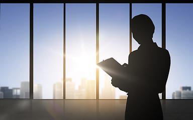 Image showing silhouette of business woman with tablet pc