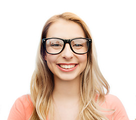 Image showing happy young woman or teenage girl in eyeglasses