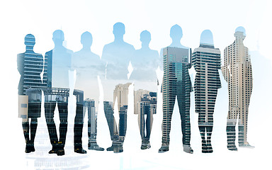 Image showing business people silhouettes over city background