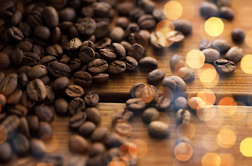 Image showing close up coffee beans on wooden table