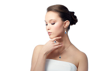 Image showing beautiful woman with earring, ring and pendant