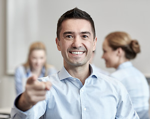 Image showing group of smiling businesspeople meeting in office