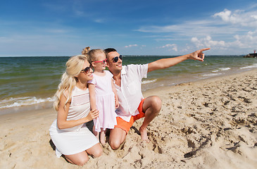 Image showing happy family in sunglasses on summer beach