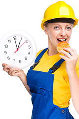 Image showing Young construction worker is going to lunch