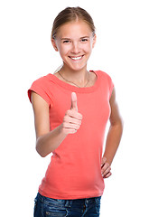 Image showing Young girl is showing thumb up gesture