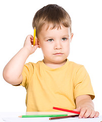 Image showing Little boy is holding color pencils