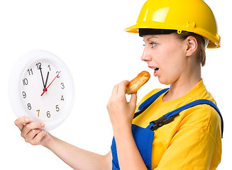Image showing Young construction worker is going to lunch