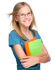 Image showing Young student girl is holding book