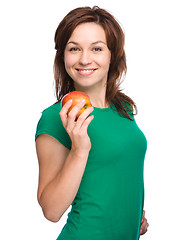 Image showing Young happy girl with apple