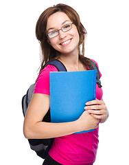 Image showing Young student girl is holding book