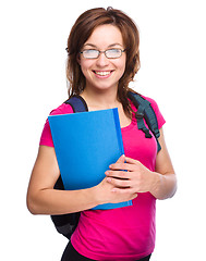 Image showing Young student girl is holding book