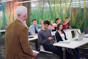 Image showing teacher with a group of students in classroom