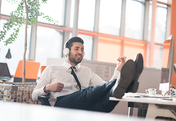 Image showing relaxed young business man at office