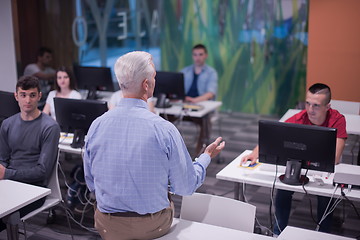 Image showing teacher and students in computer lab classroom