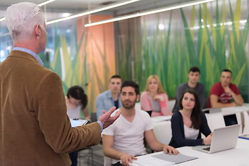 Image showing teacher with a group of students in classroom