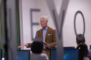 Image showing teacher and students in computer lab classroom