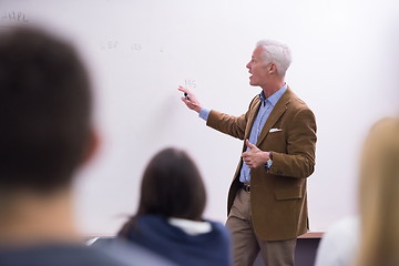 Image showing teacher with a group of students in classroom