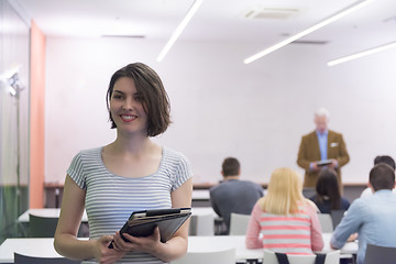 Image showing portrait of happy female student in classroom