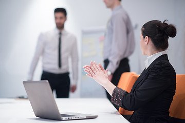 Image showing young business woman on meeting  using laptop computer