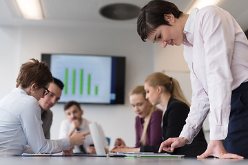 Image showing young  woman using  tablet on business meeting